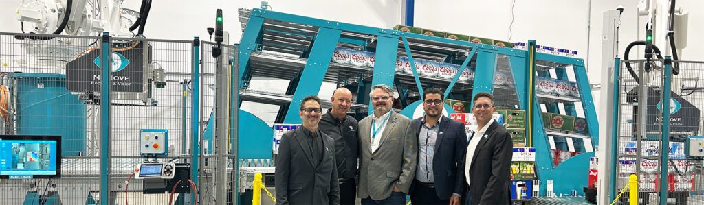 numove and kpi solutions teams in front of a new robotic order picking system for beverage warehousing